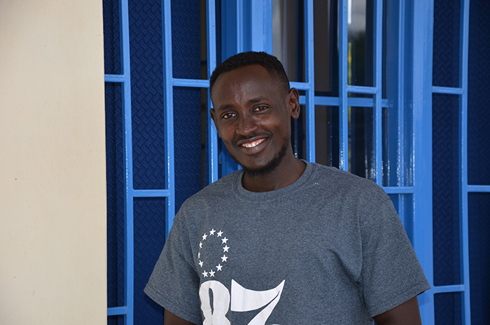 Cedric Niyonkuru, a 25-year-old refugee who fled his home in Burundi during his second year at university, is now living at Mahama Camp. Photo Credit: Cheyenne Cook, Abt Global.